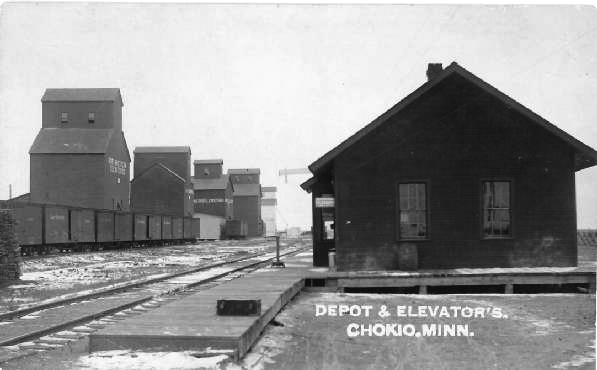 Black and white photograph of building with text that reads Depot and Elevator. Chokio Minn