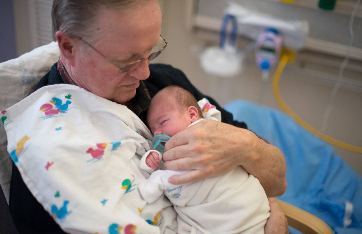 Retired Adults Volunteer as Hospital Baby Cuddlers