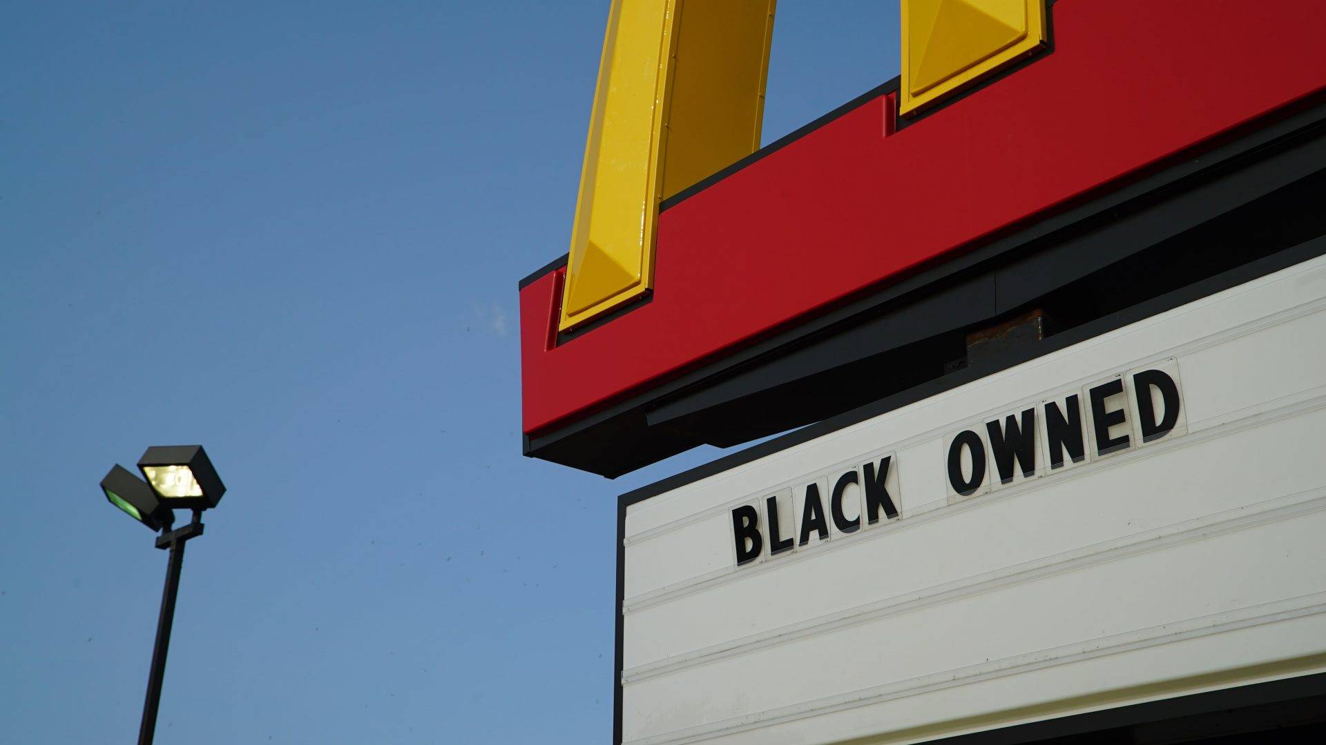 A McDonald’s sign on Lake Street reads, “Black Owned”.