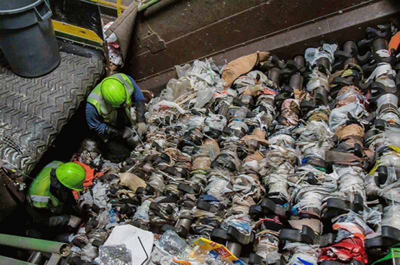 Several times a day, MRF workers have to shut down the entire process in order to manually cut out these "tanglers," causing the whole facility to grind to a halt.