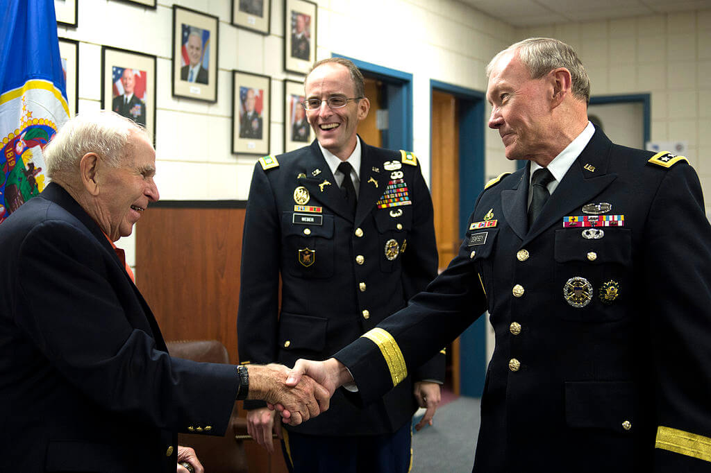 General shaking hand of two other generals