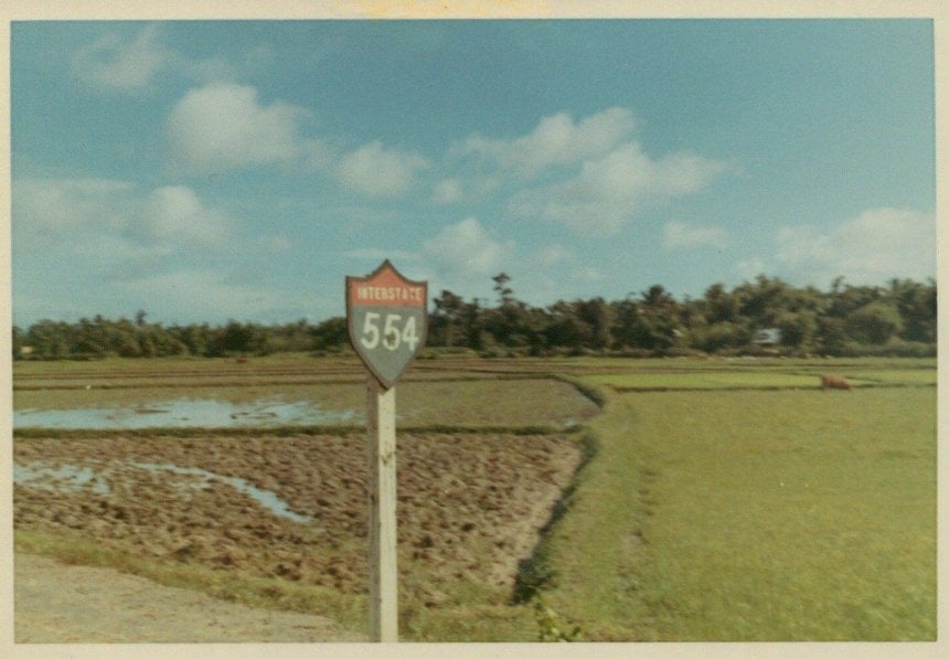 Interstate 554 sign in a field.