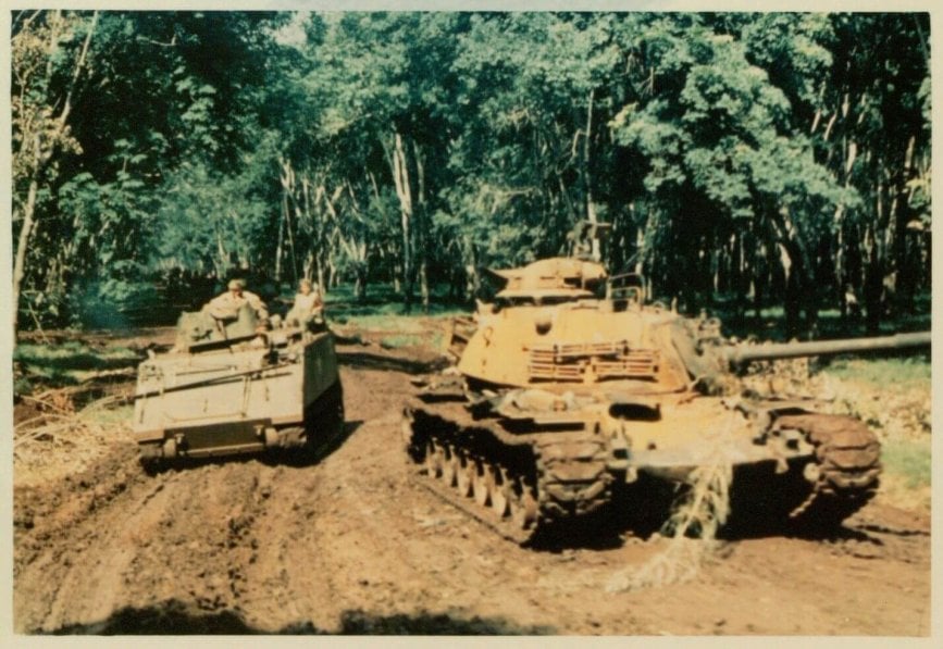 Military vehicles in the jungle.