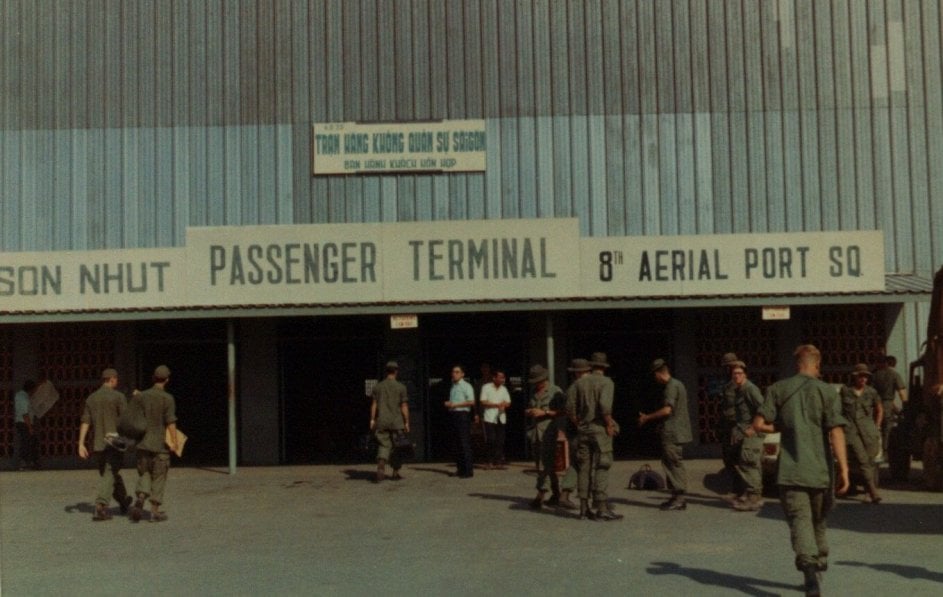 Soldiers walking into an airport.