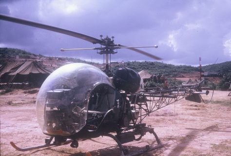 A helicopter in a clearing.