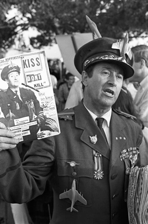 General Hersheybar, a satirical protest movement character, with a handful of spoof newspapers.