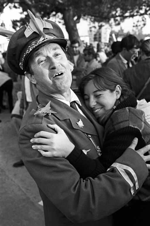General Hersheybar receiving a hug from a young female protester.