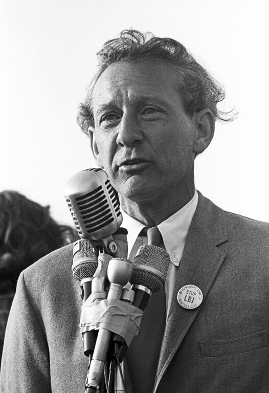 Daniel Ellsberg at the microphone, wearing a "Stop LBJ" button on his lapel.
