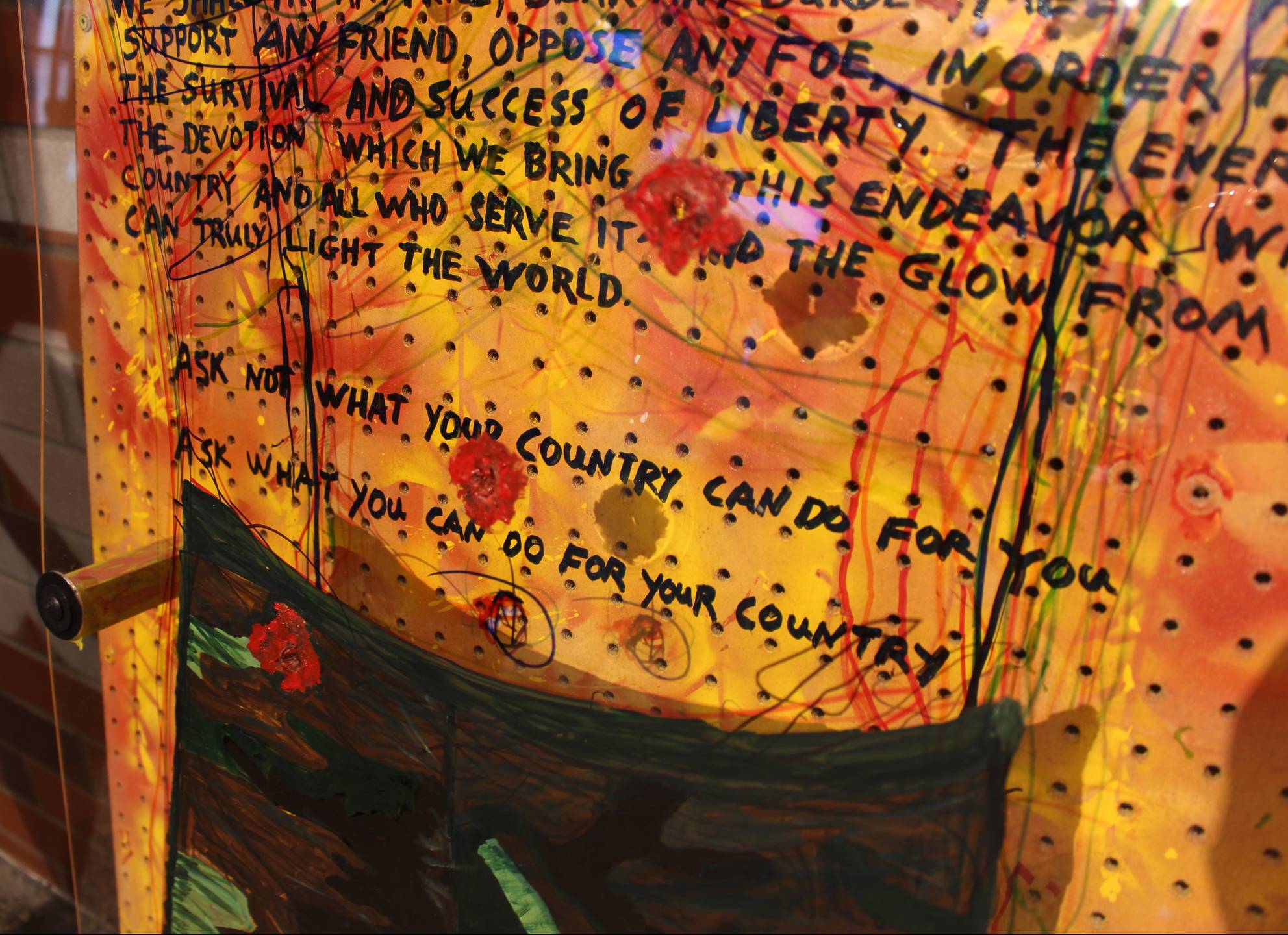 A close up of the art work described above. Includes text: "Ask not what your country can do for you. Ask what you can do for your country."