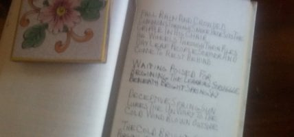 Handwritten poem in notebook.