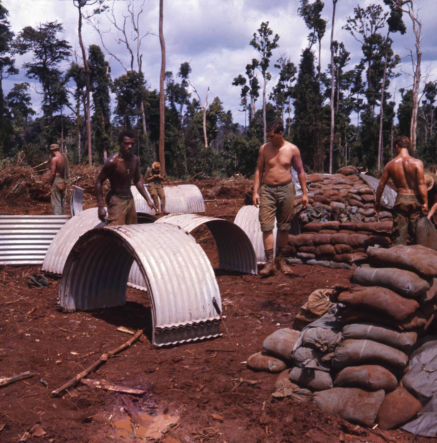 Soldiers with sandbags on a firebase.