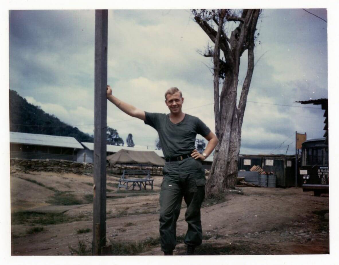 Young U.S. soldier leaning against a pole.