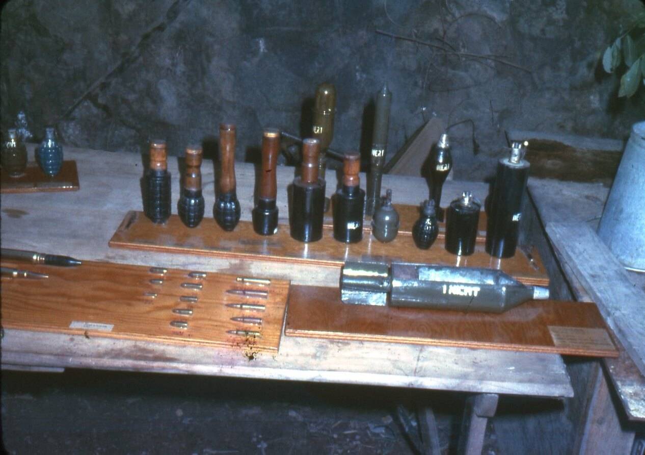 Various weapons on a table.