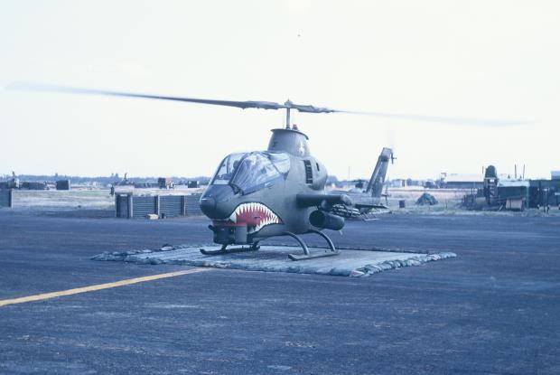 A helicopter with a painted grimacing mouth on its nose.