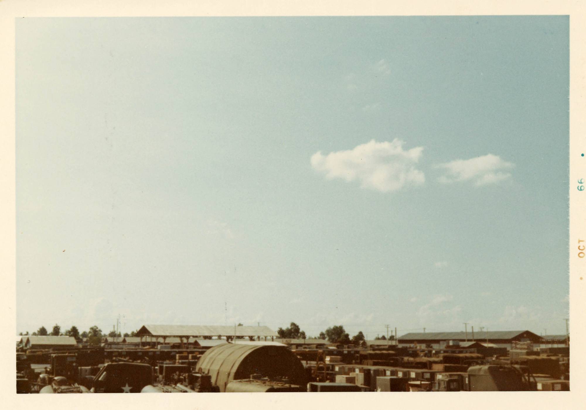 A vast blue sky with a base in the lower fraction of the photo. Margin indicates photo is from Oct 66.