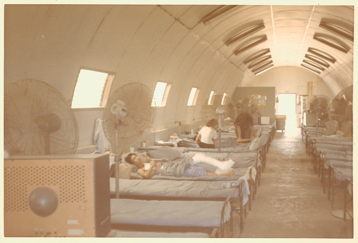 An interior shot of the hospital ward, Asian children patients in beds.