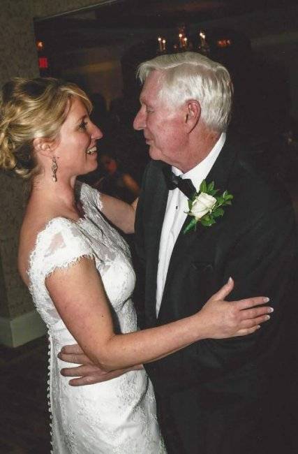 A bride dancing with her father.