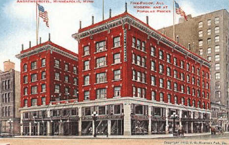 Exterior of a red brick hotel, five stories high.