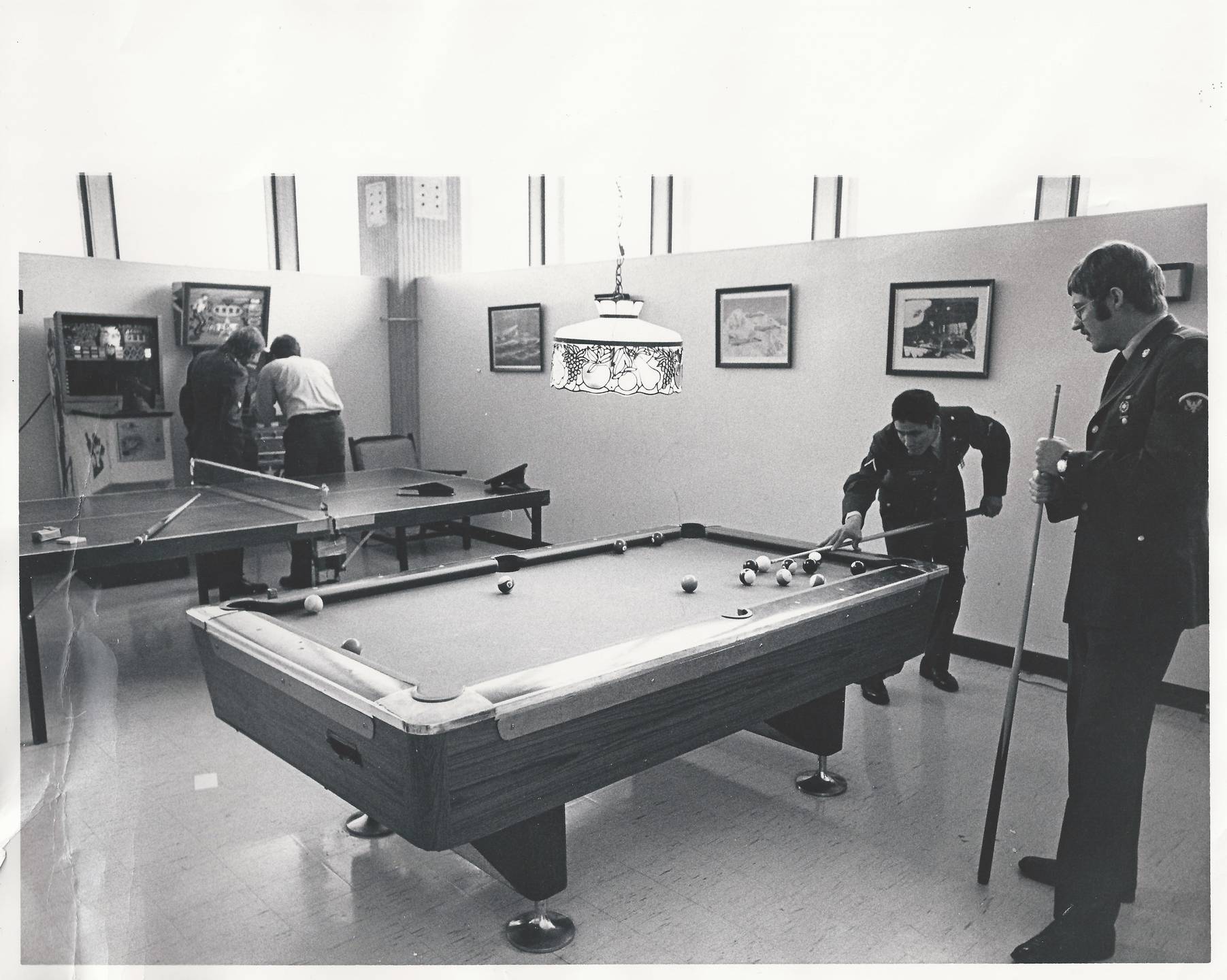 Two men playing pool.