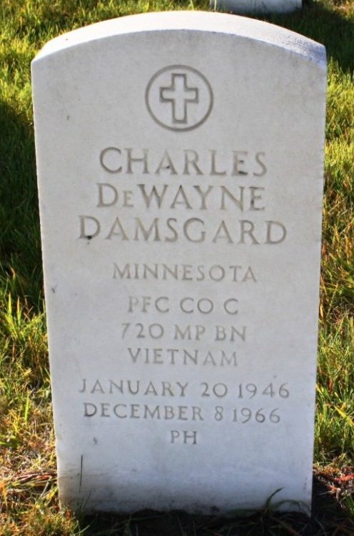 White marble tombstone: Charles DeWayne Damsgard; Minnesota; PFC CO C; 720 MP BN; Vietnam; January 20 1946; December 8 1966; PH.
