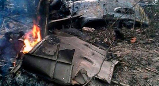 Metal sheets burning on the ground.