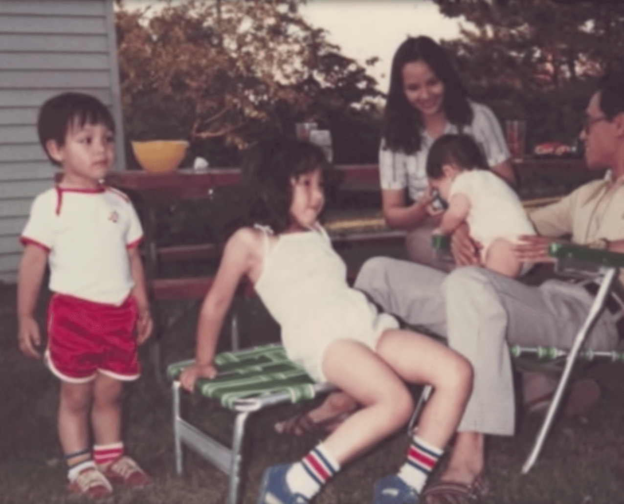VIetnamese family gathering in a backyard.