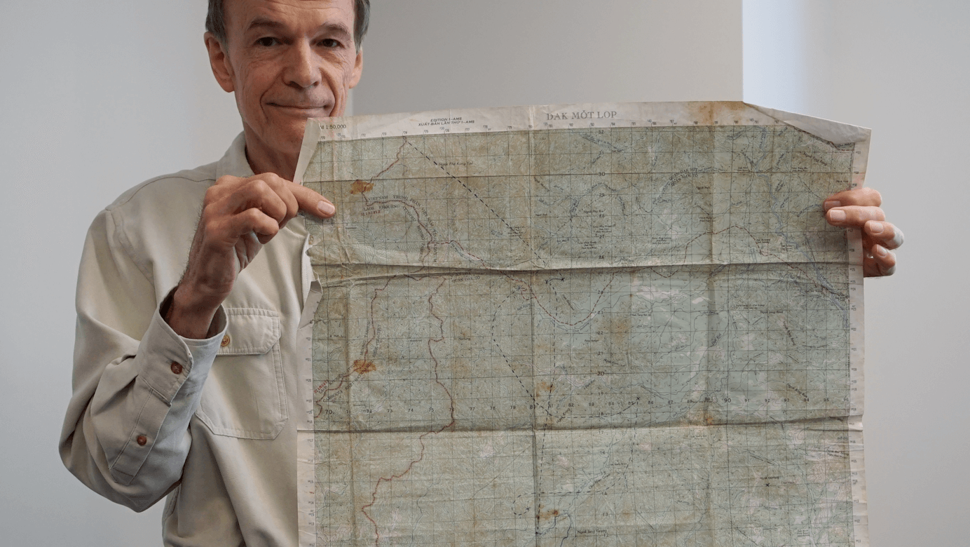 Veteran holding map.