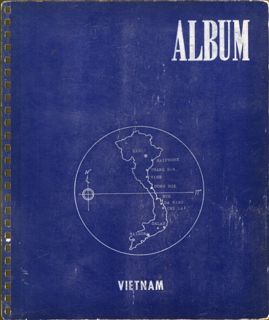A blue photo album cover with a simple map of Vietnam on it.