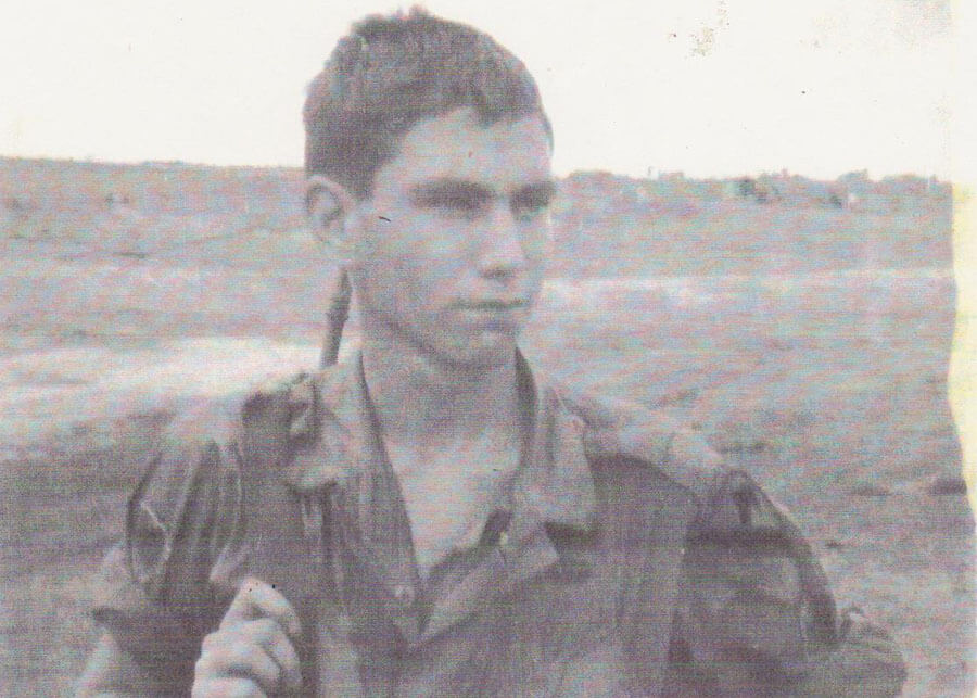 Young U.S. soldier with rifle slung on his shoulder.