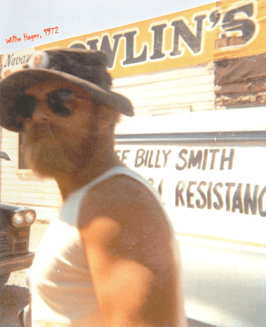 A bearded man in a tank top, sunglasses, and a boonie hat. Text on image says "Willie Hager, 1972."