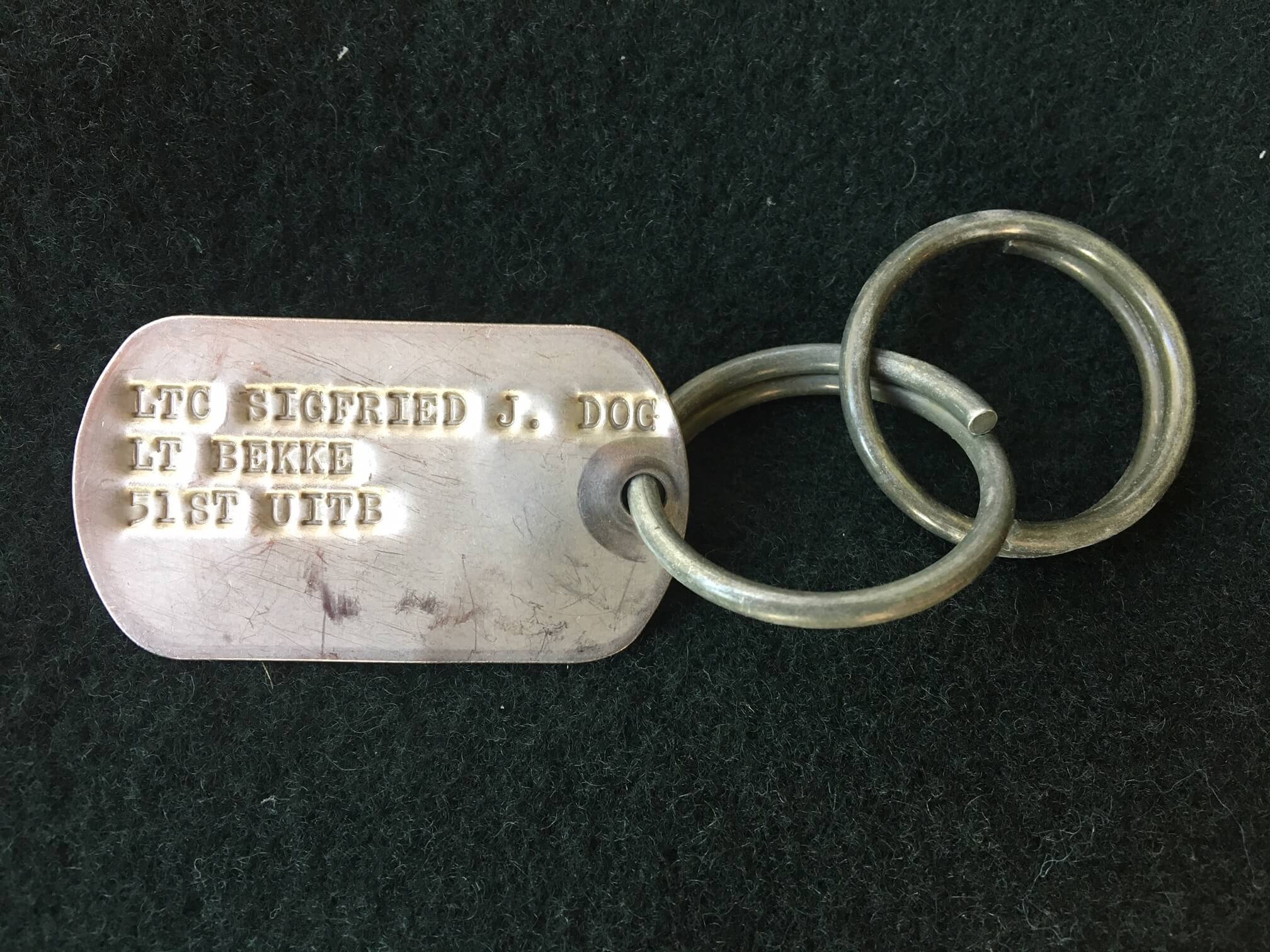 Silver army dog tag for a dog.