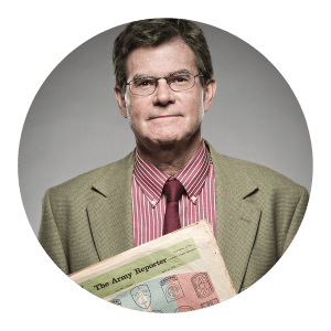 Circular portrait of a man holding an Army Reporter newspaper.