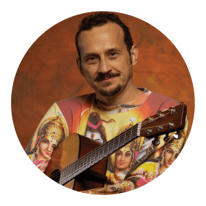 Circular portrait of a man with a guitar.