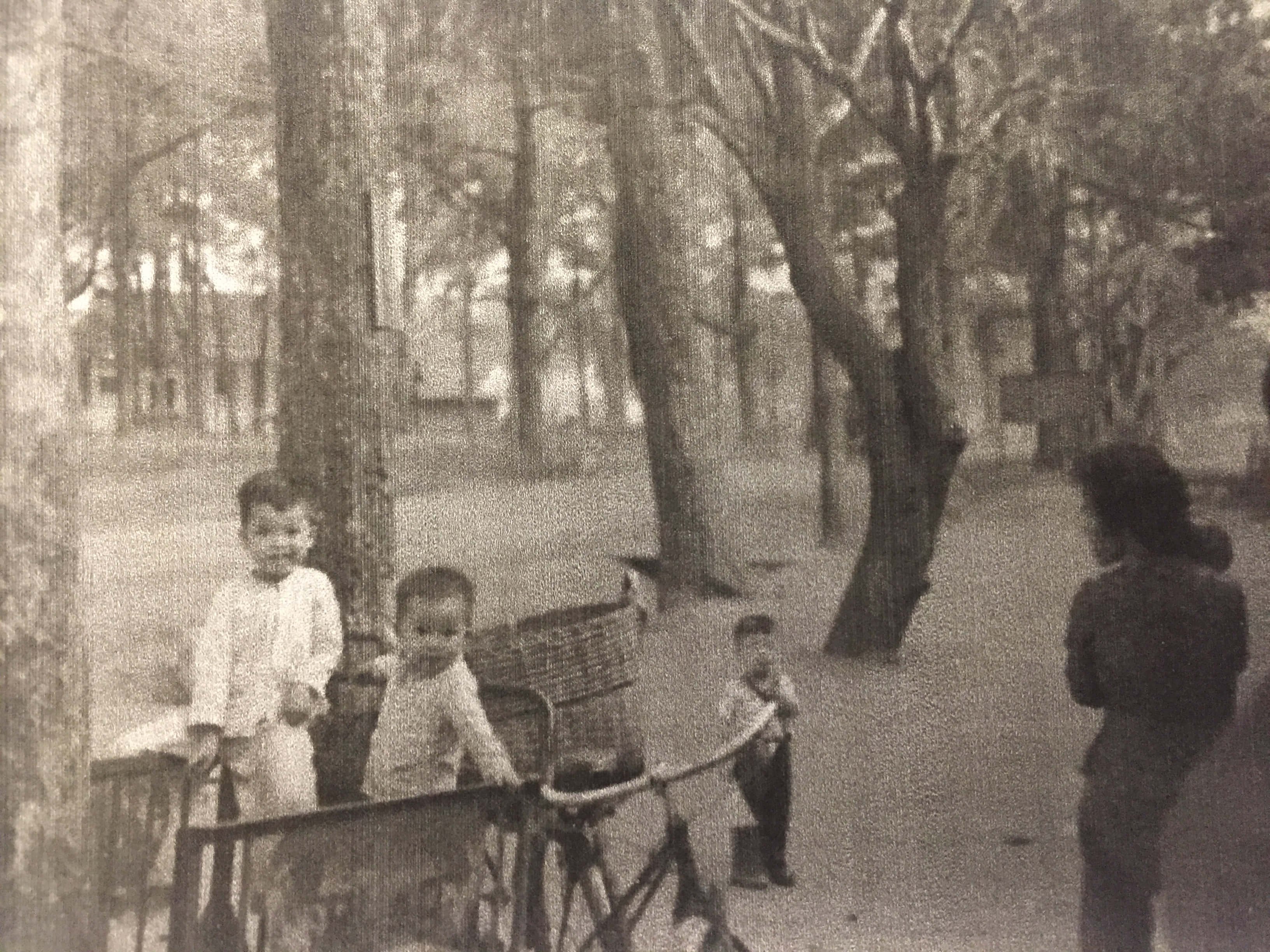 Kids hanging out near bicycles and rickshaws.