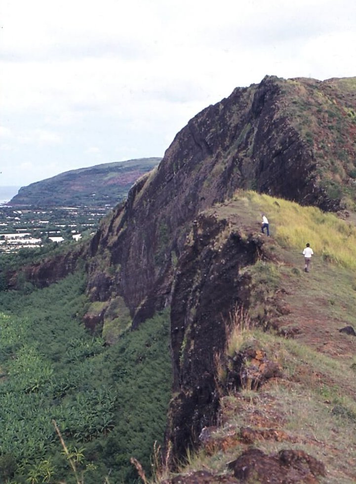 Two people hiking a mountain.