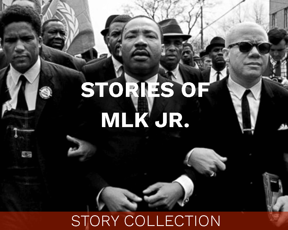 Locked arm-in-arm with other men, walking through a crowd. Text on image says "Stories of MLK Jr."