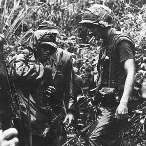 A small group of U.S. soldiers in the jungle.