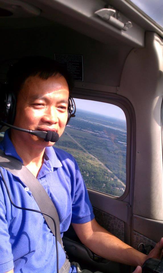 Vietnamese pilot in an airplane.