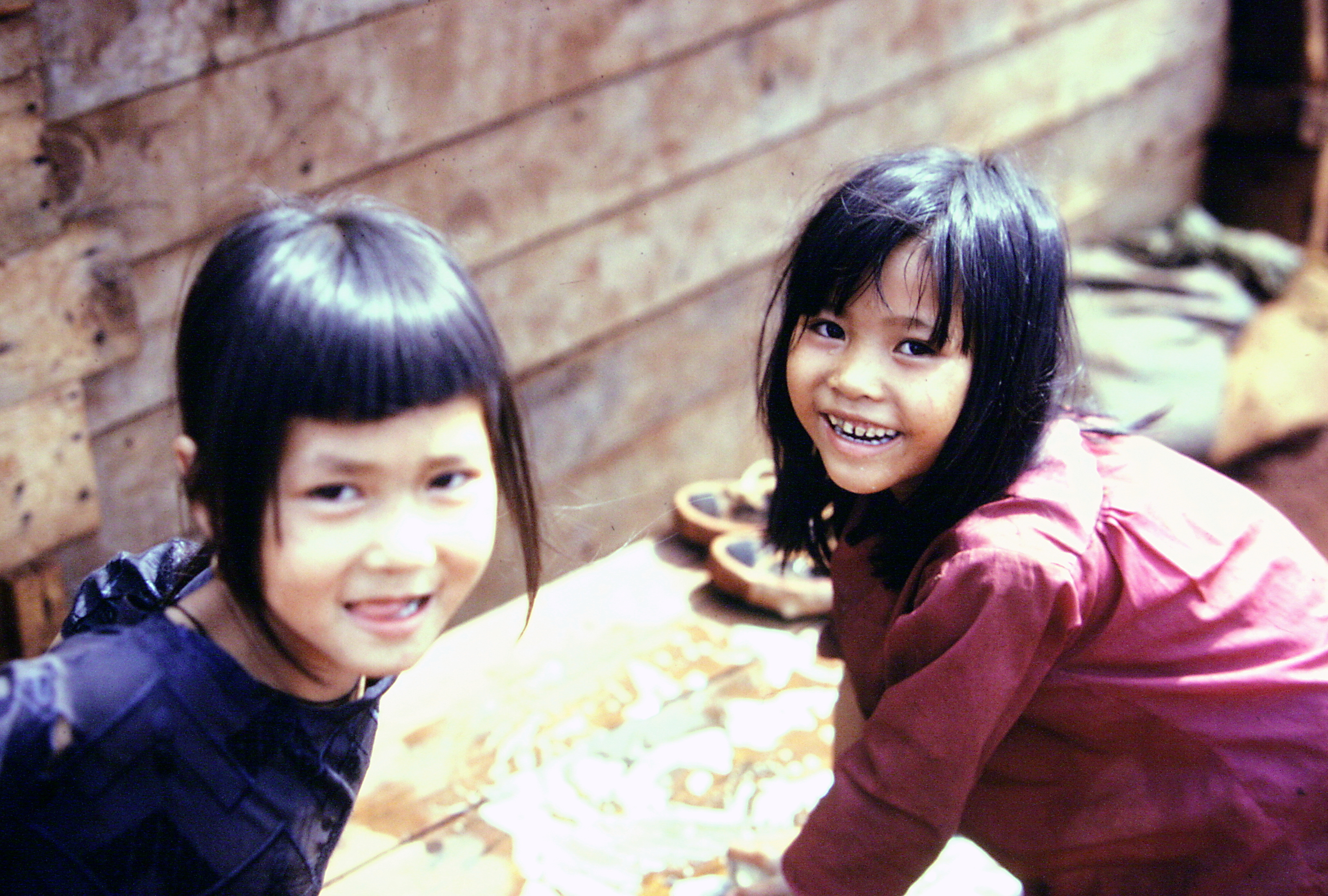 Two young Montagnard girls smiling.