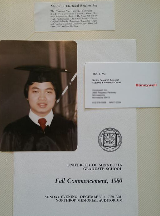 Young Vietnamese graduate in a cap and gown.