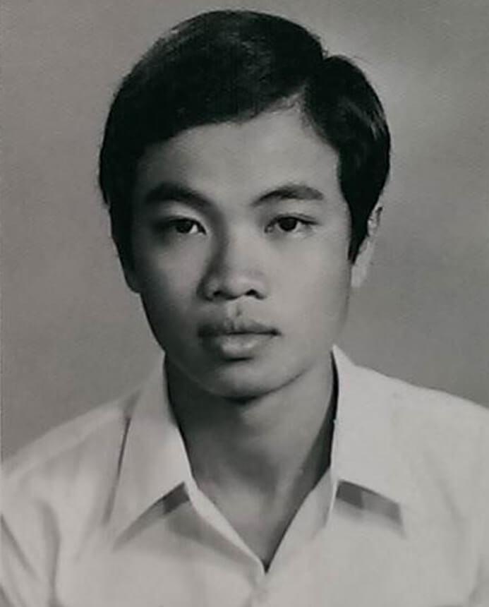 Black and white portrait of a young Vietnamese boy.