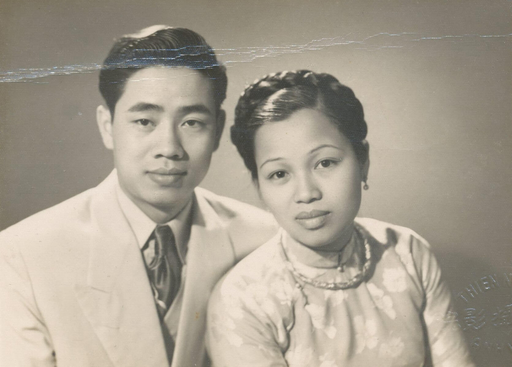 Black and white photo of young Vietnamese couple.