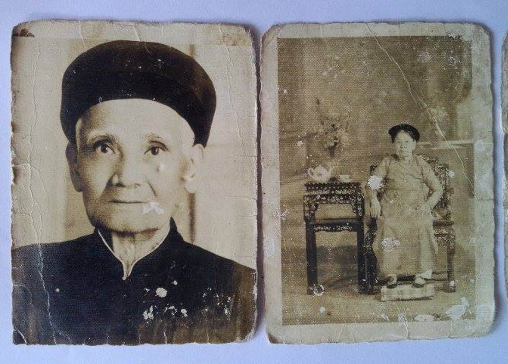 Faded portraits of a Vietnamese man and woman.