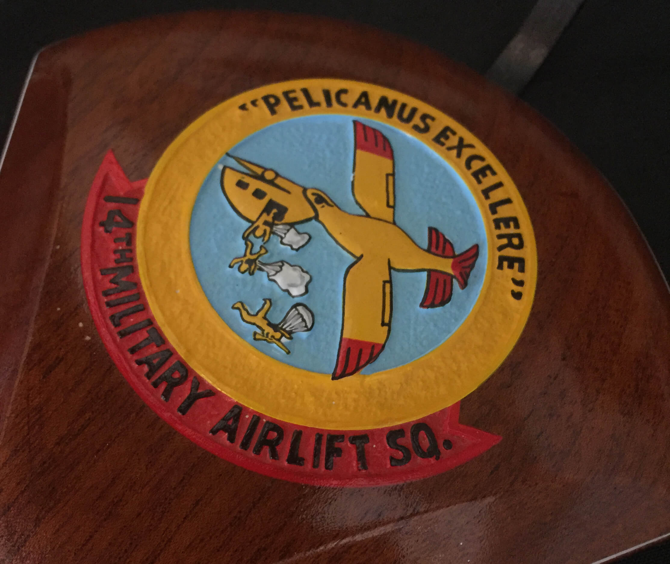 Carved insignia of a military squadron.