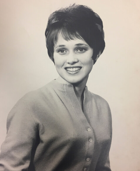 Black and white yearbook photo of a young woman.