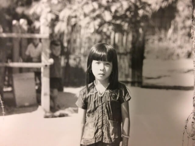 Black and white photo of a young Vietnamese child.