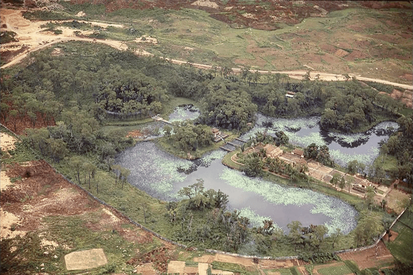 Aerial view of Asian gardens and temple.