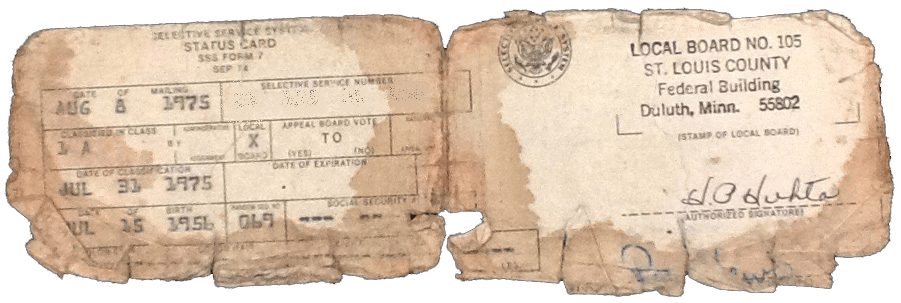 A tattered and torn selective service card issued by Duluth and St. Louis County.