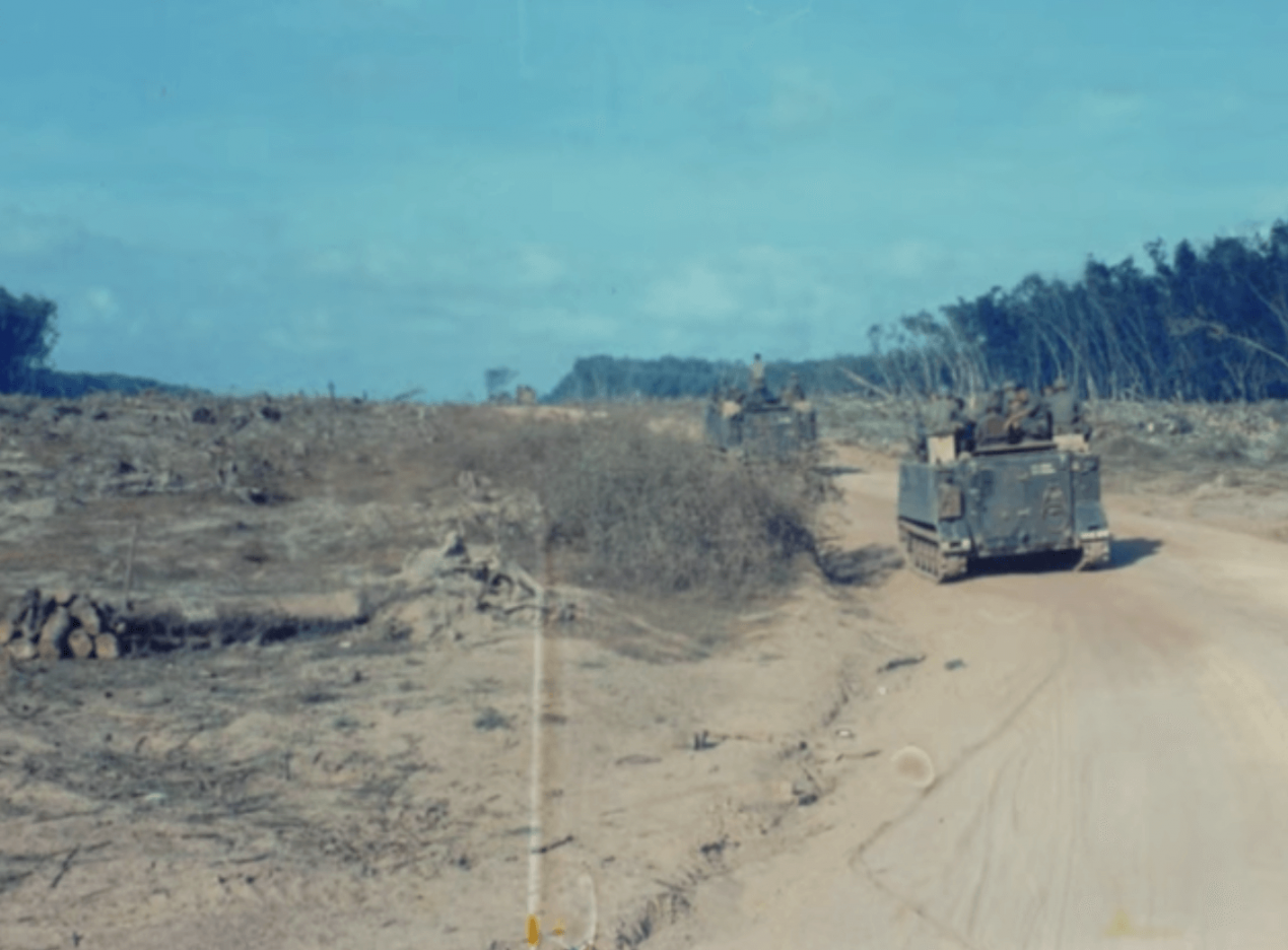 Two tanks on a dry dirt road.