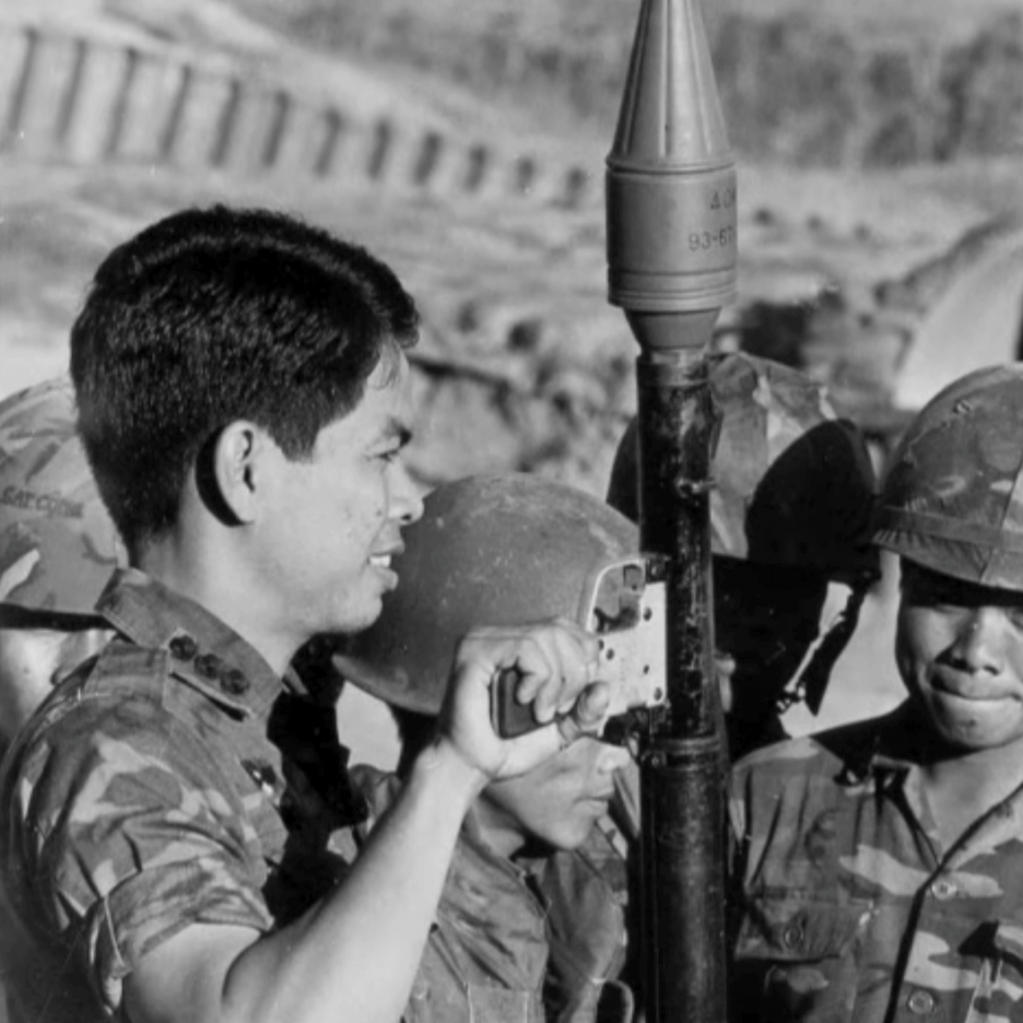 Asian soldier holding a rocket propelled grenade/RPG.